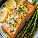 Keto Baked Salmon and Asparagus in Foil with Lemon Garlic Butter Sauce First Image First Image
